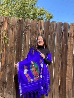 This beautiful Traditional Shawl is completely unique in both design and embroidery.  Beautiful traditional Virgin Mary design and has tassels at the end. (Colors may vary as they uniquely made although same design)  This Shawl is almost like a wrap around blanket, it is warm, comfortable and stylish. One Size Fits All Traditional Embroidered Blue Shawl, Traditional Blue Shawl With Embroidered Border, Blue Embroidered Shawl With Traditional Drape, Blue Embroidered Shawl In Traditional Drape, Mexican Blanket, Ladies Poncho, Blanket Wrap, Virgin Mary, One Size Fits All