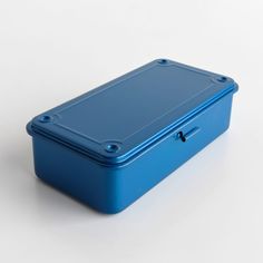 a blue lunch box sitting on top of a white table