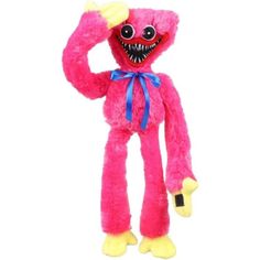 a pink stuffed animal with big teeth and large fangs on it's face, standing upright