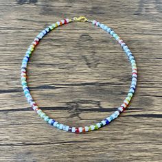 Colorful Beaded Heishi Necklace - For Men or Women :) This bright mix of beads makes the perfect Necklace/ Choker for any day. Made to order in the length and finish of your choice. Special Requests are always welcomed! Gift one for him, her or yourself <3 Festival Necklace With Round Letter Beads, Casual Heishi Beads Necklaces As Gift, Casual Heishi Bead Necklaces, Casual Heishi Beads Necklace As Gift, Multicolor Beaded Chain Strand Beads, Casual Multicolor Necklaces With Spacer Beads, Casual Single Strand Beaded Necklace, Rainbow Necklace With Spacer Beads For Beach, Heishi Beads Strand Necklaces As Gift