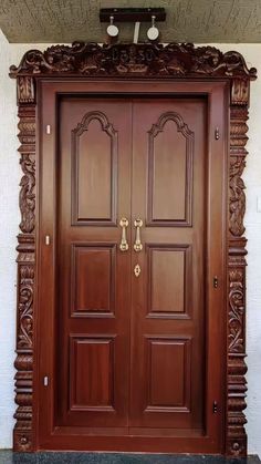 a wooden door with ornate carvings on it