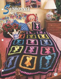 a crocheted bed with a teddy bear on it