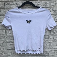 Never Worn Ribbed White Baby Tee With Butterfly Embroidery On Front! Bundle Items For Extra Savings Then Submit Offers, I Will Respond Right Away! All Items Are In Basically Brand New Condition Unless Otherwise Stated! All Items Are Washed Prior To Being Shipped And Come From A Smoke Free But Dog Friendly Home! If You Have Any Questions In Regards To Wear Or Sizing Don’t Hesitate To Comment! Thanks For Shopping My Closet Xox White Cotton Tops With Butterfly Embroidery, Summer Cotton Tops With Butterfly Embroidery, Summer Fitted Tops With Butterfly Embroidery, Trendy Summer Tops With Butterfly Embroidery, Fitted Summer Tops With Butterfly Embroidery, White Cotton Crop Top Shirt, Fitted Tops With Butterfly Embroidery For Spring, Fitted Top With Butterfly Embroidery For Spring, Fitted Butterfly Embroidery Top For Spring