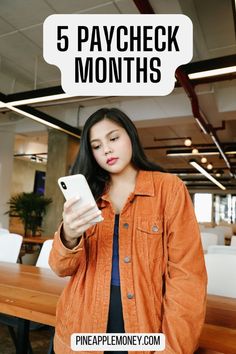 a woman in an orange jacket is looking at her phone and text reads 5 paycheck months