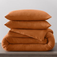 three pillows stacked on top of each other