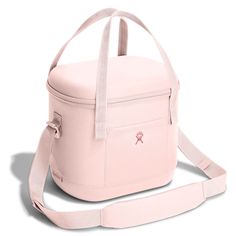 a pink lunch box with strap around the bottom and side pocket, on a white background