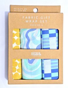 four pairs of fabric gift wrappers in a box