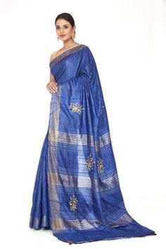 Beautiful pure tussar silk saree in blue with hand embroidery and a zari pallu.  Comes with blouse piece . Pre-draped Saree With Embroidered Border In Slub Silk, Slub Silk Pre-draped Saree With Embroidered Border, Wedding Slub Silk Pre-draped Saree With Embroidered Border, Festive Slub Silk Saree With Embroidered Border, Blue Dola Silk Traditional Wear With Embroidered Border, Festive Slub Silk Pre-draped Saree With Embroidered Border, Diwali Slub Silk Pre-draped Saree With Embroidered Border, Festive Pre-draped Slub Silk Saree With Embroidered Border, Blue Slub Silk Saree With Cutdana