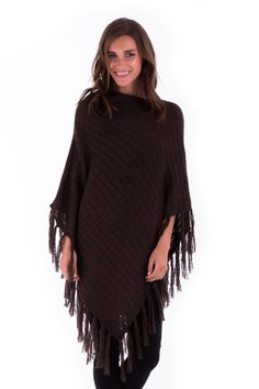 For those days or nights, you just need added warmth, look no further. You can be stylish and warm with this knit poncho. Knitted Mohair fibers offer a stylish comfort to your evening. Easily pair with a sweater and jeans, or wear for an evening stroll by the waterside. Whatever the occasion, look stylish and feel comfortable. Fringed edges Imported from Bali, Indonesia Made of soft acrylic mohair fibers Machine wash cold water, Dry Flat Cozy Acrylic Poncho, Brown Knit Poncho For Winter, Brown Knit Winter Poncho, Winter Brown Knit Poncho, Knitted Brown Poncho For Fall, Brown Knit Poncho For Fall, Cable Knit Poncho One Size, Brown Knitted Poncho, One Size Cable Knit Poncho