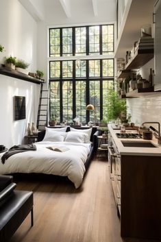 a bed sitting in the middle of a kitchen next to a window