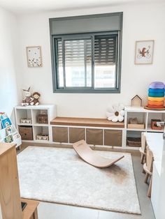 a child's play room with toys and bookshelves