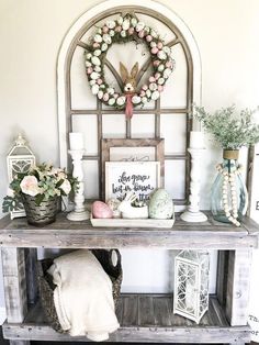 a shelf with some flowers and other items on it