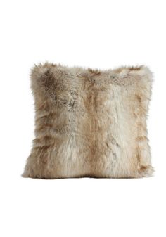 an animal fur pillow on a white background