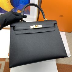 Description HRMS Kelly 28 Sellier Epsom Black Bag For Women, Handbags, Shoulder Bags 11in/28cm Rep 1:1 Hermès bags are considered the ultimate luxury item worldwide. Each piece is handcrafted with waitlists that can exceed a year or more. The streamlined and demure Kelly style is always in high demand, it is particularly lovely in this vibrant version with Gold toned hardware. Epsom is textured with a wonderful grainy appearance. Epsom is soft to the hand and maintains the shape of the bag well Louis Vuitton Shirt, Hermes Kelly 28, Chanel Shirt, Stylish Handbags, Luxury Products, Hermes Bags, Evening Clutch Bag, Black Bag, Bag For Women