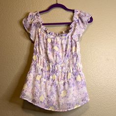 Super Cute, Nwt Lavender, Yellow And Pink Floral Peplum Top. Lined, Flirty Ruffle Sleeves, Stretchy In The Middle. Cheerful Spirits Floral Top Lavender 10\12. Floral Print Lavender Top For Vacation, Lavender Floral Print Top For Vacation, Lavender Floral Print Tops For Day Out, Casual Lavender Blouse With Floral Print, Lavender Beach Tops For Spring, Lavender Tops For Beach In Spring, Lavender Spring Beach Top, Lavender Spring Top, Feminine Lavender Floral Print Top