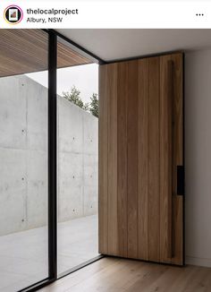 an empty room with wooden doors and sliding glass doors that lead to the outside patio