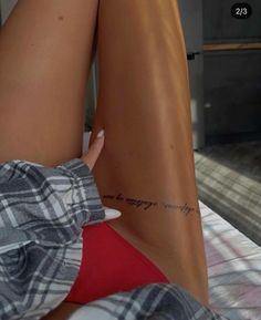 a woman's leg with a tattoo on it and the words, i am happy everything