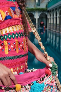 "A gorgeous crossbody bag handmade in Thailand. This bag made with Hmong tribes embroidery, gold metallic leather is the perfect boho bag for every occasion. We buy materials from the Hmong market and we design and sew by hand. Some of the bags we modify to improve the product. The Hmong tribes live in the North of Thailand and have origins from the Tibetan area of China. N.B. YOU MAY NOT RECEIVE THE EXACT BAG PICTURED HERE, AS THE FABRIC DESIGN MAY VARY SLIGHTLY FROM BAG TO BAG. THE EMBROIDERED Fabric Pom Poms, Sew By Hand, Festival Bag, Embroidered Fabric, Boho Bag, Metallic Leather, Bag Making, Crossbody Bags, Hand Sewing