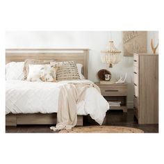 a bedroom with a bed, nightstands and other items on the floor in front of it