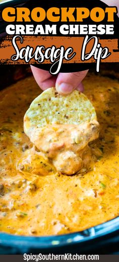 the crockpot cream cheese sausage dip is being held up with a tortilla chip