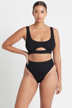 Sporty, sexy, and super supportive, the Sasha Top takes everything we love from our classic Malibu crop but with an underbust cut-out for an eye-catching twist. Designed + made in Australia, the Sasha is built to flatter, made from our unsized bound crinkle, which accentuates your curves in all the right places. Modern Seamless Swimwear For Beach, Modern Black Seamless Swimwear, Modern Seamless Swimwear For Poolside, Modern Bra-friendly Swimwear For Beach, Chic Black Seamless Swimwear, Modern Seamless Swimwear For Pool, Sleek Seamless Swimwear For Poolside, Modern Black Swimwear For Pool, Modern Solid Color Seamless Swimwear