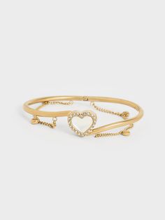 Wear your heart on your wrist with the Annalise cuff bangle. A semi-precious heart-shaped stone is set in the middle of the gold-tone bangle and wreathed in crystals for an extra-sparkly finish. Dangly chain links and heart charms further add to the feminine charm of the Annalise, making it an elegant piece to add to your bracelet stack. Due to the nature of semi-precious stones, the actual product received may vary from the product images shown on the website. Colours may appear lighter or dark Chain Links, Semi Precious Stones, Stone Heart, Heart On, Cuff Bangles, Crystal Heart, Product Images, Bracelet Stack, Heart Charm