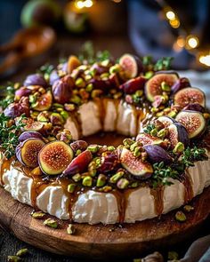 a cake is decorated with figs and nuts