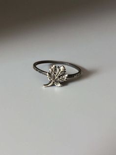 Welcome to Miss November Studio! I specialize in dainty feminine personalized jewelry for the discerning jewelry lover. This listing is for a single sterling silver maple leaf stacking ring. All other rings are sold separately. Make a stack! Add a custom stamped band and two gemstone stacking rings with stones like black onyx and garnet. https://www.etsy.com/listing/150142799/set-of-3-rings-one-personalized-message ********** Stacking rings are excellent accessories, not to mention fun to collect and wear. One ring worn alone is dainty, two is quaint, but a loaded stack is a statement! I love to mix and match my stacking rings. I mix metals and make different stacker themes. Occasionally I wear a single stacking ring with a mantra or a word of encouragement to meditate on. ********** Pleas Everyday Silver Nature-inspired Jewelry, Minimalist Sterling Silver Leaf Jewelry, Minimalist Leaf-shaped Sterling Silver Jewelry, Nickel-free Leaf-shaped Nature-inspired Jewelry, Handmade Leaf-shaped Everyday Jewelry, Handmade Everyday Leaf-shaped Jewelry, Everyday Handmade Leaf-shaped Jewelry, Hypoallergenic Leaf-shaped Nature-inspired Jewelry, Everyday Nature-inspired Leaf Jewelry