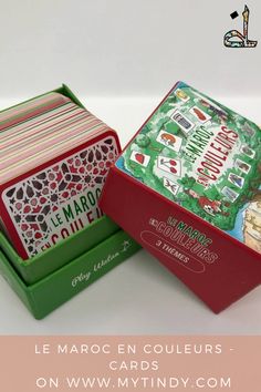 two boxes with different designs on them and the words merry christmas written in spanish are next to each other