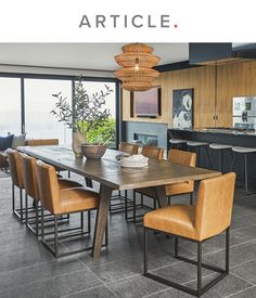 a dining room table surrounded by chairs with the words article above it