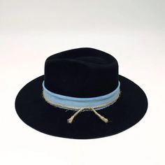 Looking for a stylish and unique felt hat? Look no further than the Coltrane Felt Hat! This stunning hat comes in two colors, black or brown, with a thick blue or light brown corduroy fabric hat band. The crown is 4", brim 3" it also features a thin twine detail that gives it a touch of elegance. Whether you're looking for a new statement piece for your wardrobe or a gift for a loved one, the Coltrane Felt Hat is sure to impress. Online Purchase Only Fedora Hats For Women, Womens Fedora Hat, Wide Brim Felt Hat, American Hat Makers, American Hat, Womens Fedora, Birthday Discount, Fedora Hats, Felt Fedora