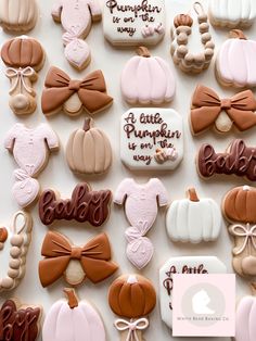 decorated cookies are arranged on a table with the words, pumpkins and baby's breath