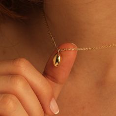 14K 18K Real Gold Cremation Urn Tear drop Necklace, Gold Urn Drop Pendant, Gold Ash Holder Pendant, Necklace For Ashes, Keepsake Memorial Necklace D E T A I L S - Material: 14K (585), 18K (750) Real Gold (Genuine, not plated or filled) - Handcrafted with care C U S T O M I Z E Craft your jewelry into a reflection of your unique essence! Transform your jewelry with our curated collection of bespoke adornments, featuring personalized motifs, initials, engravings, and birthstones. Chain Thickness: * Chain #A: 0.85 mm * Chain #B: 1.05 mm * Chain #C: 1.35 mm C R A F T M A N S H I P  ‣ Each piece is meticulously handcrafted to order. ‣ Our commitment to quality is unwavering. Enjoy a lifetime warranty against manufacturing defects. ‣ Sourced from the historic gold and jewelry markets of Istanbul Gold Necklace With Polished Finish For Memorial, Yellow Gold Brass Necklace For Memorial, Gold Cremation Necklace, Drop Necklace Gold, Ash Necklace Cremation Jewelry, Gold Urn Necklaces For Ashes, Gold Urn, Ash Jewelry, Memorial Jewelry Ashes