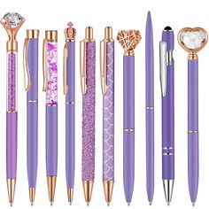 the different types of pens are shown in purple and gold colors, including one with a diamond