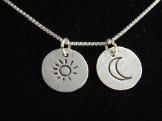 "A tiny sun and moon charm come together on this simple necklace to remind you to Live by the Sun and Love by the Moon. Each charm is handcrafted from fine silver and they come on your choice of 16\", 18\" or 20\" sterling silver box chain. The charms measure 1/2\" each, they hang independently and will move when worn. The necklace will be gift boxed and will ship 3-5 business days after purchase." Sterling Silver Charm Necklace With Sun And Moon Design, Sterling Silver Sun And Moon Pendant Charm Necklace, Sterling Silver Pendant Necklace With Sun And Moon Design, Silver Moon Charm Necklace With Sun And Moon Design, Sterling Silver Moon-shaped Charms Necklaces, Bohemian Sterling Silver Moon Charm Necklace, Sterling Silver Moon Charm Necklace For Everyday, Dainty Sterling Silver Moon Phase Charm Necklace, Bohemian Sterling Silver Necklace With Moon Charm