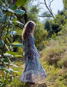 Indulge in the ethereal beauty of our Audrey Maxi Dress with Butterfly Sleeves in Blue. This stunning piece is crafted from 100% Indian cotton, making it soft and comfortable against your skin. The intricate butterfly sleeves add a touch of whimsy and romance, making you feel like a true goddess. The dress features a beautiful blue print that will transport you to a dreamy paradise. The flowy maxi length adds a touch of elegance and grace to your every step. Whether you're strolling along the be Long Hippie Boho Dress For Spring, Free-spirited Tunic Dresses For Spring, Free-spirited Spring Tunic Dress, Flowy Free-spirited Boho Dress For Spring, Ethereal Beach Dress For Spring, Green Bohemian Dress With Bell Sleeves, Ethereal Spring Beach Dress, Blue Bohemian Maxi Dress For Fall, Green Bohemian Bell Sleeve Dresses