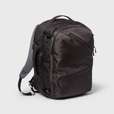 the back view of a black backpack on a white background with grey straps and zippers