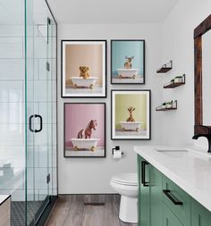 a bathroom with pictures on the wall above the toilet and tub, along with a sink