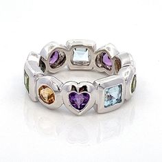 "Multi Gemstone Birthstones Sterling Silver Stacking Band Ring- Amethyst, Blue Topaz, Citrine, Peridot- Vintage Size 7.25- ET1203 Size: 7.75 - can be resized Metal Content: .925 Sterling Silver Stones: Genuine Amethyst, Blue Topaz, Citrine & Peridot Face Height (North to South): 1/4\" (7mm) Amethyst, Blue Topaz, Citrine, Peridot Stones are Genuine Weight: 7.08 Grams Stamps: KN 925 China Condition:  Excellent Pre-Owned Vintage ring  Each piece is thoroughly examined and refinished as needed by ou Multicolor Amethyst Ring In Sterling Silver For Anniversary, Multicolor Amethyst Sterling Silver Ring For Anniversary, Multicolor Amethyst Ring Gift, Silver Stackable Gemstones For Anniversary, Multicolor Amethyst Rings With Accent Stones, Anniversary Multi-stone Amethyst Gemstones, Multicolor Amethyst Rings For Anniversary, Fusion Gemstones With Accent Stones For Anniversary, Stackable Bands