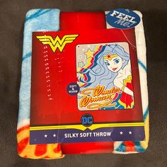 the back side of a fleece blanket with an image of wonder woman on it