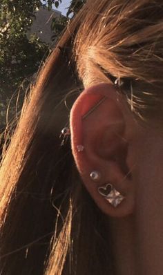 a person with ear piercings on their ears