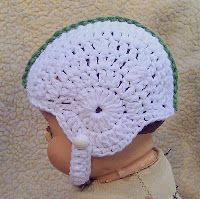 a small child wearing a crocheted hat