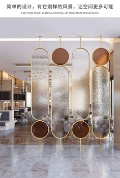 an advertisement for a modern home with gold accents and round mirrors on the wall, along with