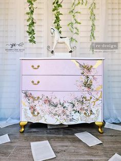 a dresser with flowers painted on it