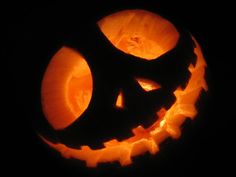 a carved jack o lantern in the dark