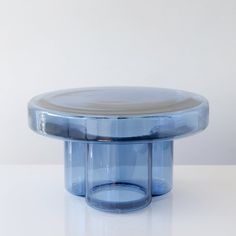 a round blue object sitting on top of a white table