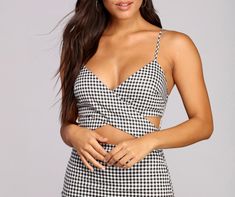 Look totally girly in trendy gingham with this cute mini dress! It features a sleeveless bodice. adjustable spaghetti straps. a wrap front V neckline. a waist cut out. a hidden back zipper and hook and eye closure. and a short. form hugging fit. The dress is composed of a lined woven fabric with no stretch.Model is 5'7" with a 34" bust. 24" waist and 36" hips. She is wearing a size small. Chic Spaghetti Strap Mini Dress For Picnic, Gingham Mini Dress, Cute Mini Dress, Short Form, Children Shoes, Mini Black Dress, Woven Fabric, Gingham, Spaghetti Strap