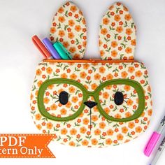 an animal shaped pencil case with glasses on it