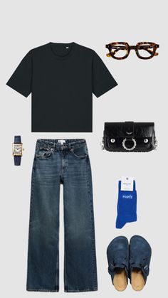 a black t - shirt, jeans and shoes with accessories