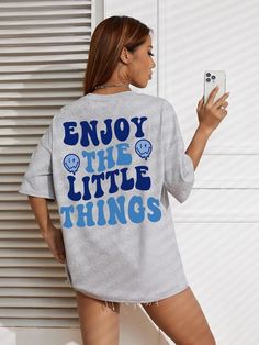 Introducing the FZ Women's Enjoy The Little Things Oversized Tee, a stylish and fashionable addition to your wardrobe. With a loose fit and a trendy "Enjoy The Little Things" letter print, this tee is perfect for making a statement while staying comfortable. Embrace the little things and elevate your style with this must-have tee. Style: Streetwear Clothing Length: regular Decoration: none Elasticity: Medium Stretch Sleeve Style: regular Fabric Type: Broadcloth Material: COTTON Pattern Type: letter Sleeve Length(cm): short Fit: Fits true to size, take your normal size Pattern Them: Creativity Item Type: tops Gender: WOMEN Trendy Oversized T-shirt With Letter Print, Oversized T-shirt With Letter Print And Drop Shoulder, Oversized Gray Slogan Tops, Oversized Gray Tops With Slogan, Trendy Gray Tops For Leisure, Trendy Gray Top For Leisure, Oversized Letter Print Tops For Leisure, Drop Shoulder Letter Print Tops For Loungewear, Drop Shoulder Tops With Letter Print For Loungewear